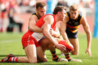 Will Hayward is tackled by Brodie Smith.