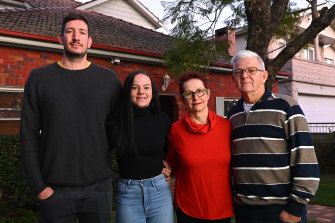 Claire Walker with partner Hugh and her parents outside their family home
