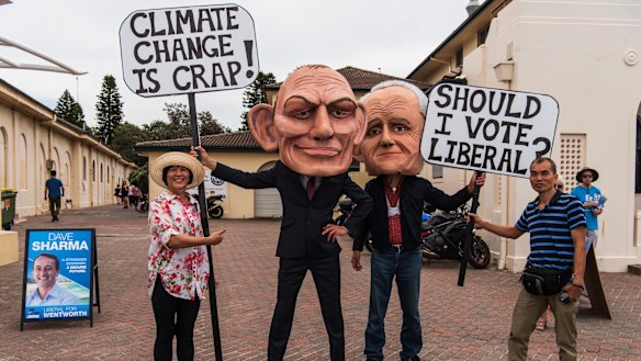Members of GetUp! dressed in costumes of Tony Abbott and Malcolm Turnbull at Bondi Surf Bathers SLSC polling booth. 