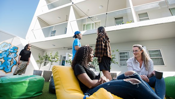 UKO Stanmore resident Fadzai Manungo talking to host Jamie Page in the common areas.