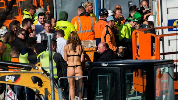 Scantily clad women serving beer to Geocon workers at a company function in 2016. 