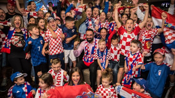 General Manager Roye Estephan, centre, with pumped Croatian football fans at Sydney's King Tom Club.