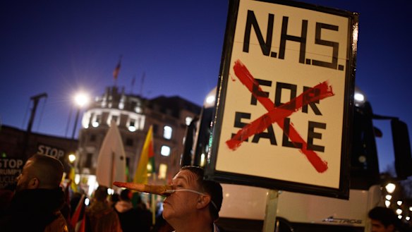 A protester at a NHS rally during a visit to London by US President Donald Trump. 