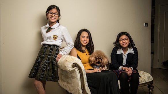 "The standard is higher": Yuliana Hartanto with her two daughters, Sienna, 12, and Felicia, 15. 