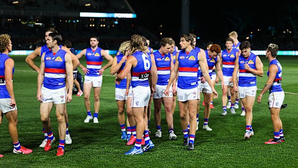 The Western Bulldogs walk off after their 13-point loss to ladder leaders Port Adelaide.