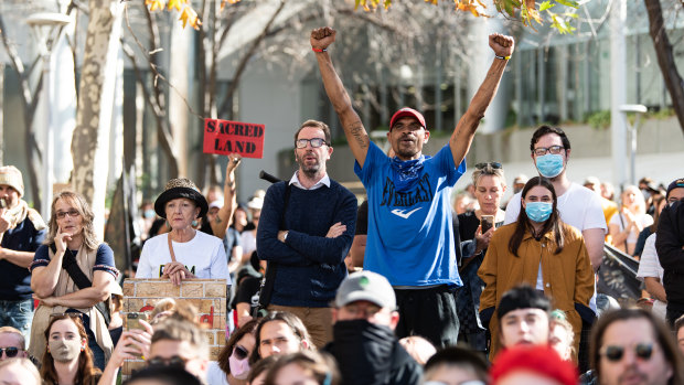 Protesters rally outside Rio Tinto's Perth headquarters. 