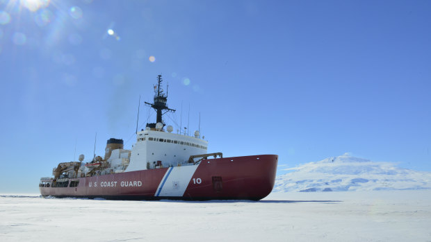 The Coast Guard Cutter Polar Star breaks ice in McMurdo Sound near Antarctica in support of Operation Deep Freeze.