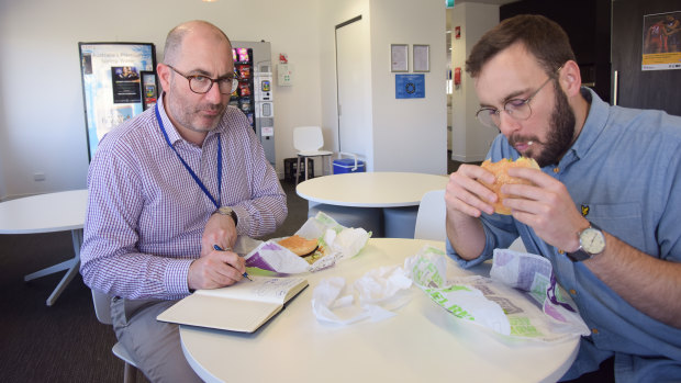 WAtoday political reporter Nathan Hondros and homepage editor Cameron Myles sample the Rebel Whopper. 