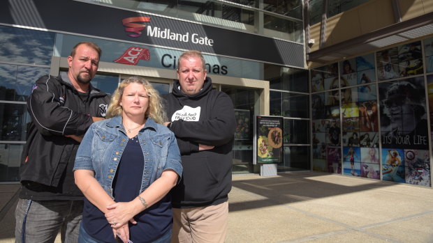 Ned and Karen Stamenich with Retail and Fast Food Workers Union secretary Josh Cullinan outside the Midland Gate shopping centre in Perth's east where their Donut King store is located.