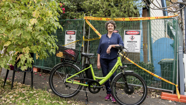 Melanie Sandford is locked out of her destroyed home in Leichhardt, but back on her e-bike.