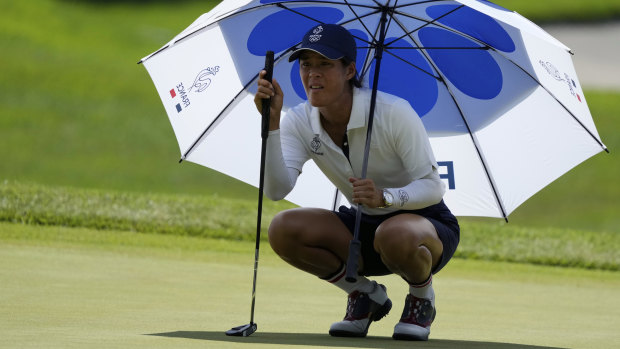 France’s Celine Boutier tries to avoid the heat.