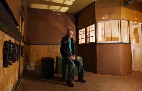 Volunteer guide Barry McDonald in the almost renovated former plotting rooms for the North Head artillery. 