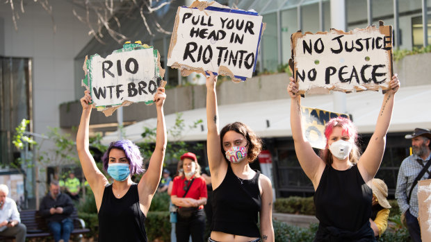 Hundreds rally outside Rio Tinto's Perth headquarters following the destruction of a significant Aboriginal heritage site. 