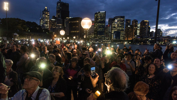 At least 1000 people turned up to the harbour foreshore on Tuesday night, protesting against a projection promoting The Everest horse race on the Opera House.