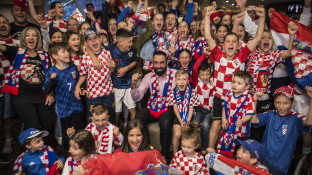 General Manager Roye Estephan, centre, with pumped Croatian football fans at Sydney's King Tom Club.