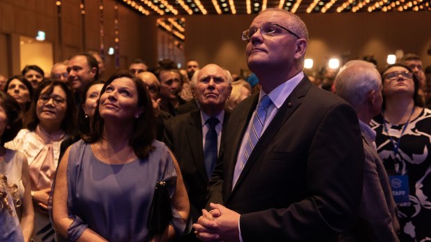 Scott Morrison and his wife Jenny, with former prime minister John Howard, await the result of the NSW election in Sydney.