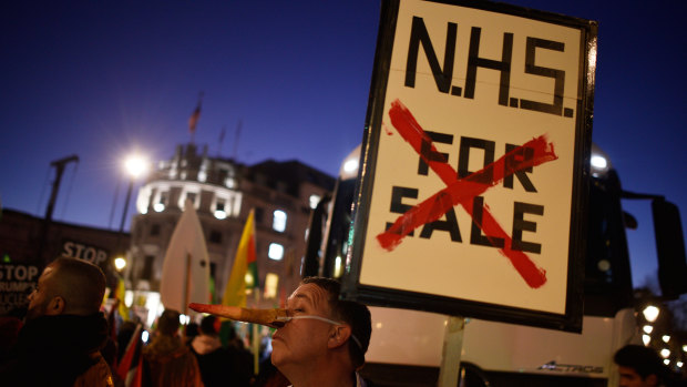 A protester at a NHS rally during a visit to London by US President Donald Trump. 