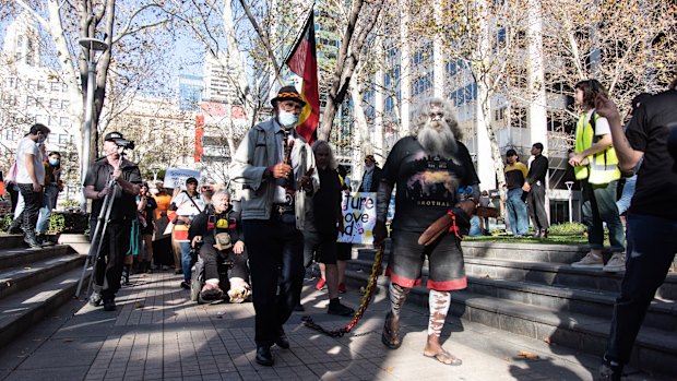 Protest organisers Uncle Ben and Herbert Bropho march to Rio Tinto's headquarters to hand over a letter of demands. 