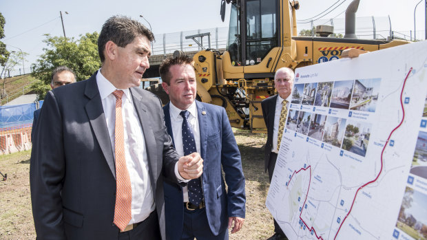 Parramatta MP Geoff Lee, left, and acting Transport Minister Paul Toole mark the start of major construction of the light rail line.