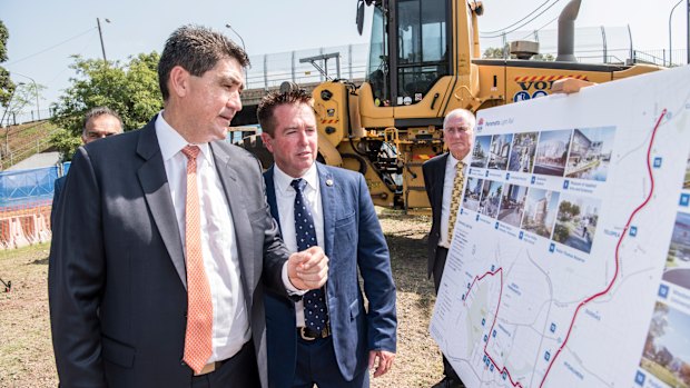 Parramatta MP Geoff Lee, left, and acting Transport Minister Paul Toole mark the start of major construction of the light rail line.