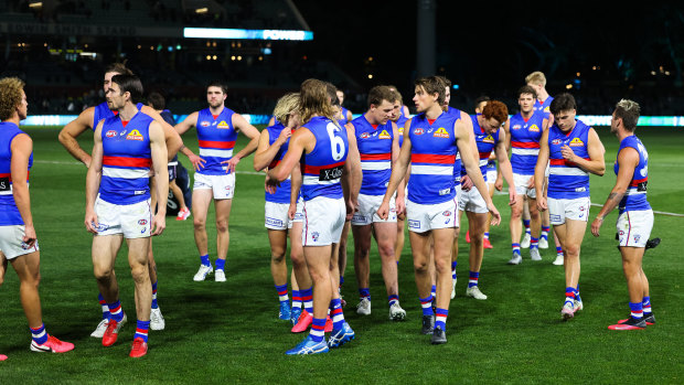 The Western Bulldogs walk off after their 13-point loss to ladder leaders Port Adelaide.
