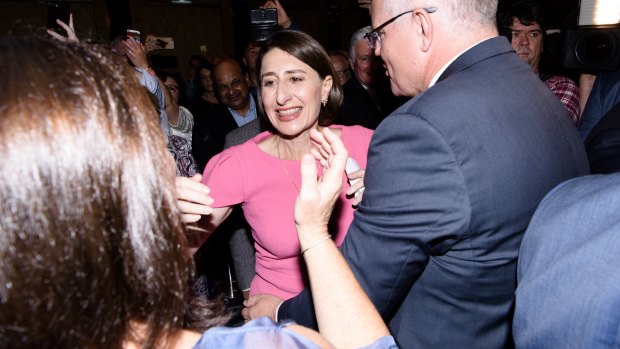 NSW Premier Gladys Berejiklian is greeted by Prime Minister Scott Morrison as she enters the ballroom of the Sofitel Wentworth for her victory celebrations.