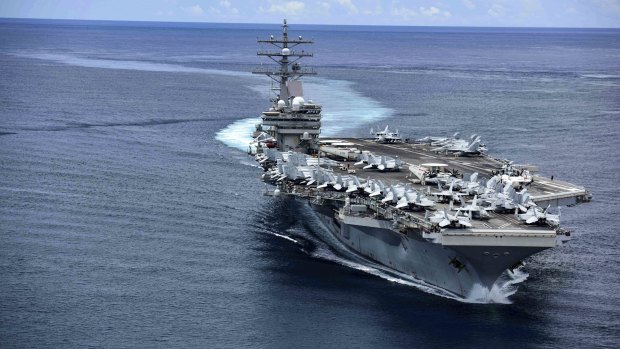 Aircraft carrier USS Ronald Reagan steams through the San Bernardino Strait, crossing from the Philippine Sea into the South China Sea. 