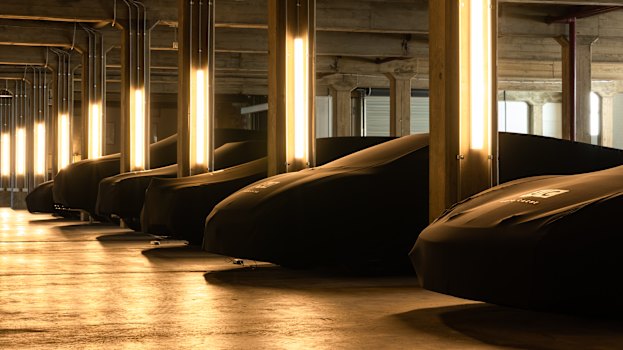 Priceless supercars sit in secret with bespoke cloth covers.