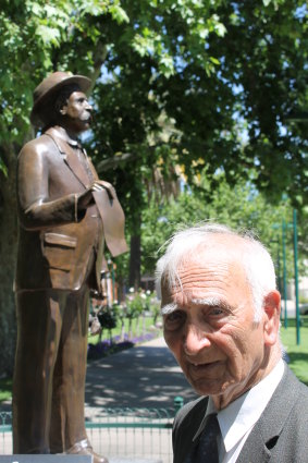 Uncle Boydie with a statue of his grandfather, William Cooper, in 2018.