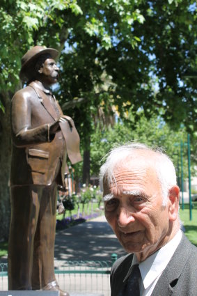 Uncle Boydie with a statue of his grandfather, William Cooper, in 2018.