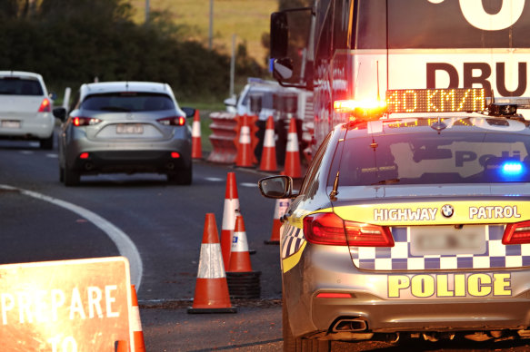 Motorists drive through the former 'ring of steel' checkpoint at the border of Sunbury and Gisborne South on the Calder Freeway on Monday morning. 