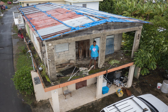 Jetsabel Osorio stands in her house damaged five years ago by Hurricane Maria before the arrival of Hurricane Fiona in Loiza, Puerto Rico.