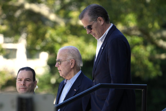 US President Joe Biden and son Hunter leave St Edmond Catholic Church in Rehoboth Beach, Delaware on Saturday.