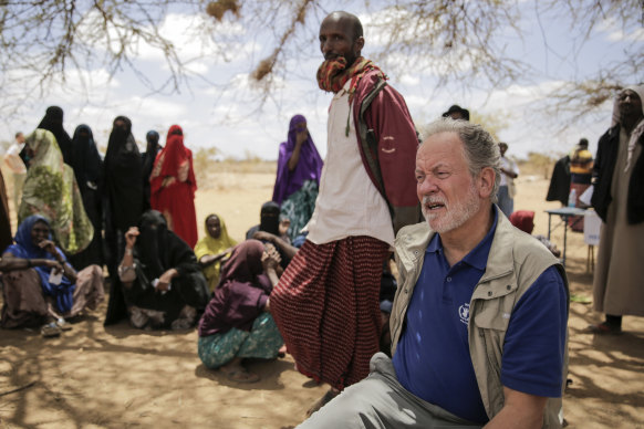 World Food Program chief David Beasley meets villagers in Wagalla, northern Kenya, in August. 