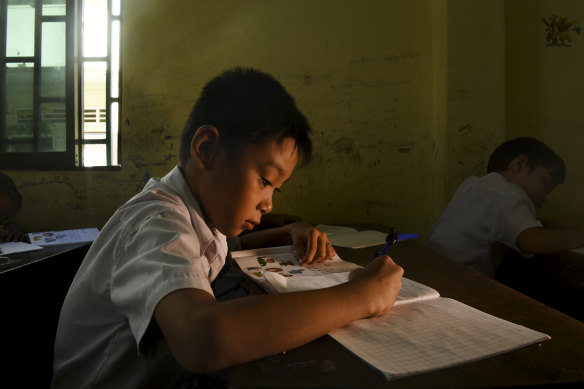 Hope for the future: Cambodian students learning Chinese and English at a school in Sihanoukville in 2018. 