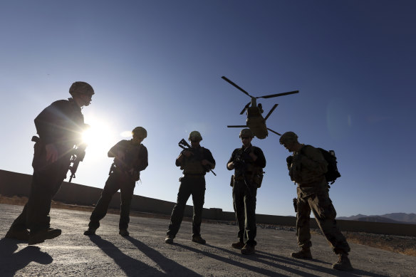 American soldiers wait on the tarmac in Logar province, Afghanistan, in 2017.