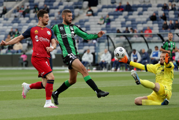 Tomi Juric is denied in his shot at goal for Adelaide United.