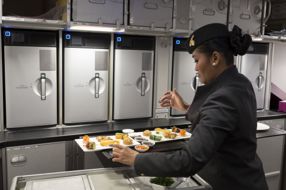 Qatar Airways crew will change before serving food on board.