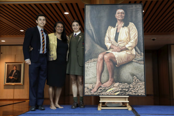 Senator Nova Peris with children Jack 
and Destiny and her portrait at Parliament House in Canberra on  Wednesday.