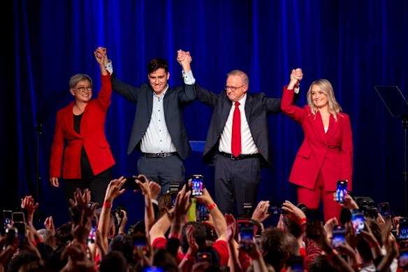 Wong (left) celebrates with Albanese, his son Nathan and fiancee Jodie Haydon on stage on Saturday night.