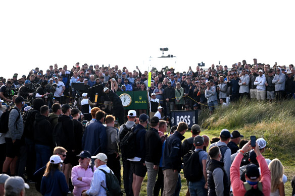 Jon Rahm tees off on the 15th hole in front of a huge opening-round crowd at the Open.