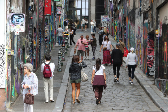 Nature is healing with tourists back taking photos of graffiti in Hosier Lane. 