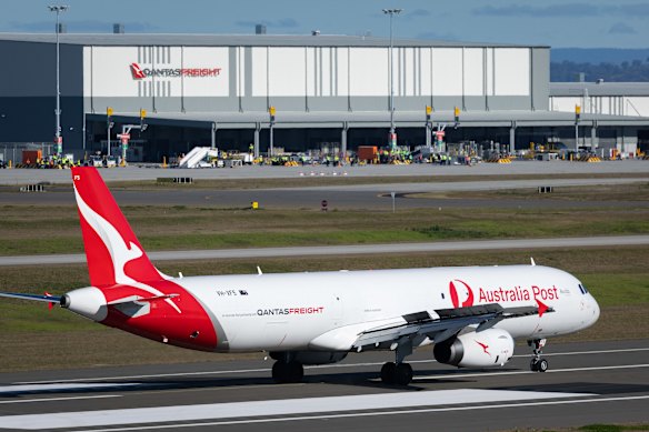 A Qantas cargo aircraft lands at Western Sydney Airport on July 13 as part of trials ahead of the opening of the cargo precinct. 