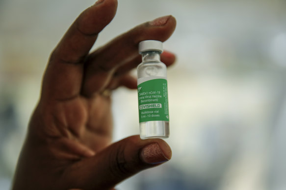 A nurse holds a vial of the AstraZeneca COVID-19 vaccine, manufactured by the Serum Institute of India and provided through the global COVAX initiative, in Machakos, Kenya.