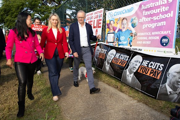 Reid MP Sally Sitou (left) on the campaign trail with Prime Minister Anthony Albanese and his fiancee Jodie Haydon.