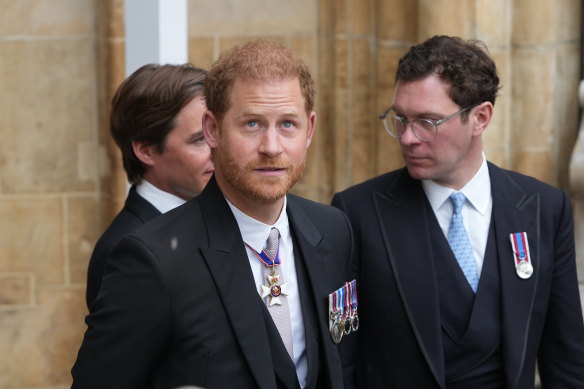 Prince Harry leaves after the coronation - he would still be wearing his medals when he arrived at the airport.