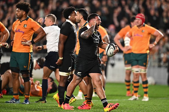 The Wallabies watch on as Codie Taylor and the All Blacks celebrate a try at Eden Park.