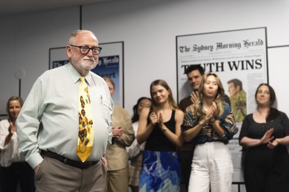 Ross Gittins is congratulated celebrating 50 years at the Herald in the newsroom last month.