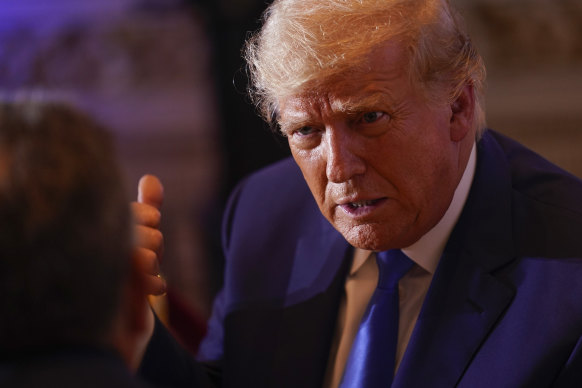 Former president Donald Trump talks with people at Mar-a-lago on Election Day.