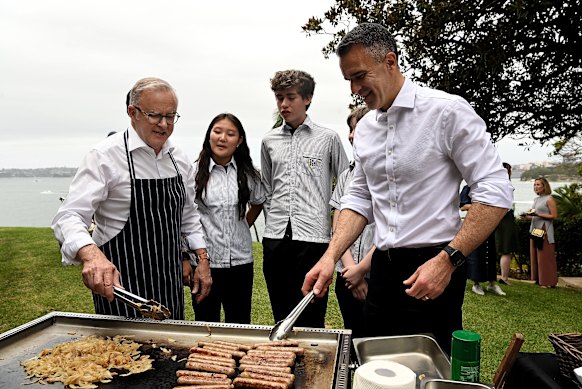 Prime Minister Anthony Albanese and South Australian Premier Peter Malinauskas talk to Inner Sydney High School students over a barbecue.